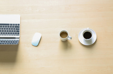 flat lay coffee cup and laptop in wood table