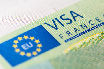 Schengen visa in the passport. Issued by the French Embassy. This sample of the Schengen visa has been put into circulation since 2019. Selective focus.