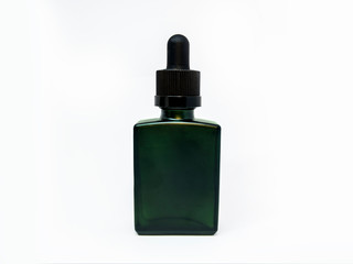 Cannabis extract oil in a green tincture bottle