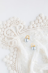 Vintage style blue pearl earrings on lace