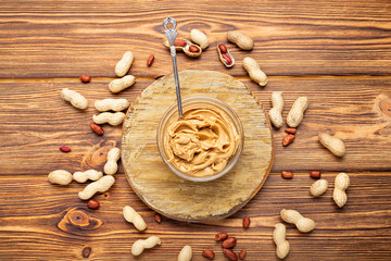 Toast sandwich with peanut butter. Spoon and jar of peanut butter and peanuts for cooking breakfast...