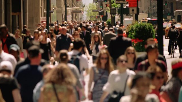 Crowded avenue. New York City. US. People walking in busy street of Manhattan. Traffic passing by. More options in my portfolio.