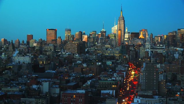 Time Lapse aerial of New York City, turquoise sky to dark, busy modern life scene, Static shot
