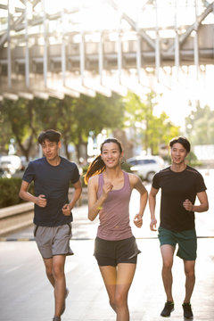Young friends running outdoors