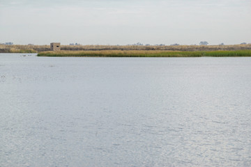 USA, California, Kern County, Kern National Wildlife Refuge. A duck hunting blind along the shores of a lake.
