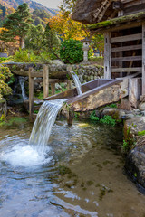 Fototapeta na wymiar Water mill at the Historic Village of Ogimachi in Shirakawa-gō, UNESCO World Heritage Site, Japan.