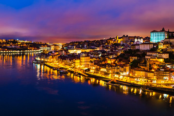 Fototapeta na wymiar Porto city skyline, night cityscape panorama from Luis I bridge of Porto, Portugal