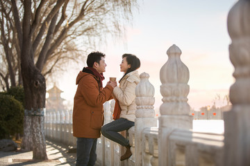Happy young couple dating outdoors in winter