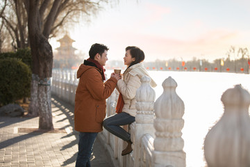 Happy young couple dating outdoors in winter