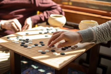 Happy father and son playing the game of go