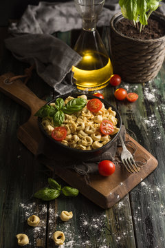 Homemade ravioli with basil and tomatoes