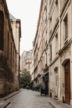 Urban street of aged district with gothic architecture in Paris