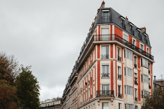 From below of colorful building in Paris, France on cloudy day