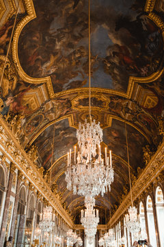 Painting ceiling with fresco and chandelier in palace of Paris