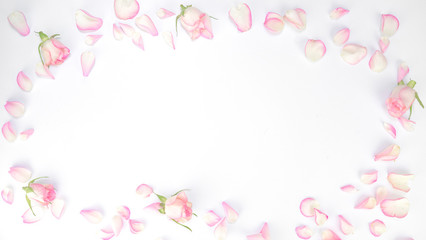 Naklejka na ściany i meble Valentine's day, Mother's day , love background - Frame made of pink roses, petals, leaves isolated on white texture, top view with space for text