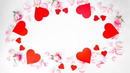 Valentine's day, Mother's day , love background - Frame made of pink roses, petals, leaves and red wooden hearts isolated on white texture