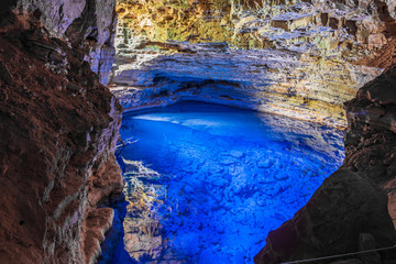 Incredible transparent blue water pond inside cave in Brazil