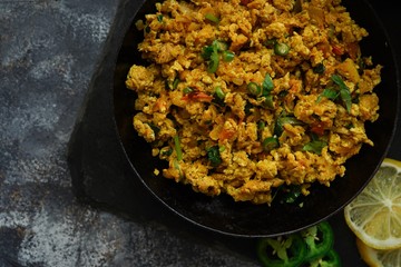 Scrambled eggs/ Masala egg Bhurji served with roti, selective focus