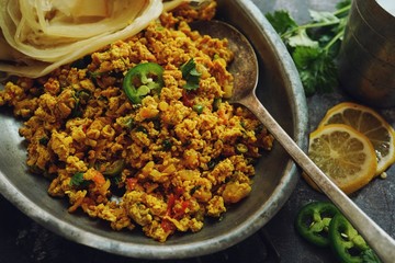 Scrambled eggs/ Masala egg Bhurji served with roti, selective focus