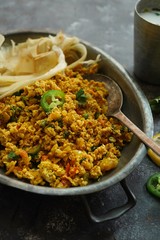 Scrambled eggs/ Masala egg Bhurji served with roti, selective focus