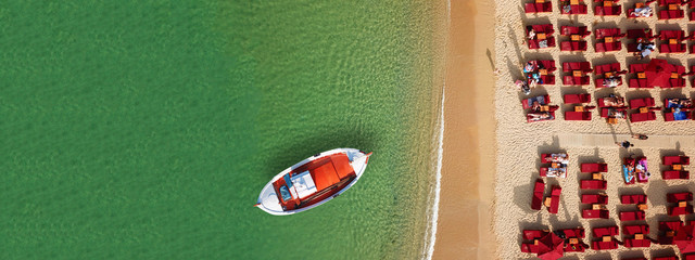Aerial drone ultra wide photo of beautiful wooden traditional fishing boat docked in famous...