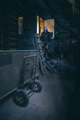 man in gas mask respirator exploring abandoned building 