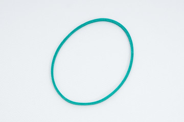 Green elastic bands on a white background