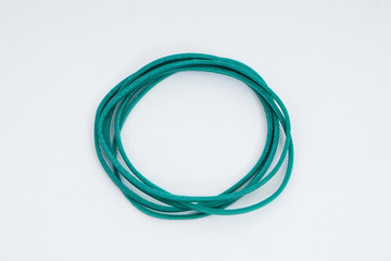 Green elastic bands on a white background