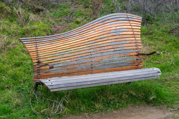 USA, California, San Mateo County, Half Moon Bay. A surreal public park bench with a whimsical...