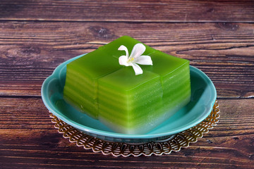 Thai dessert : Steamed Layer sweet cake (or Khanom Chan) Thai traditional dessert (Green Pandan flavour). One of nine famous Thai auspicious desserts in Thailand. Space for texts.