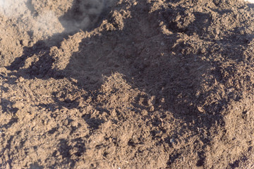 Full frame close-up background of dark organic compost pile