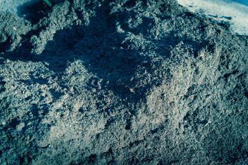 Full frame close-up background of dark organic compost pile