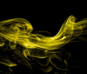 Yellow smoke on black background