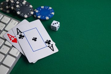 Poker online, casino, online gaming business. Chips, money cards and pc.