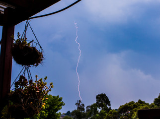 Cloud to ground lightning on the rear of a thunderstorm.