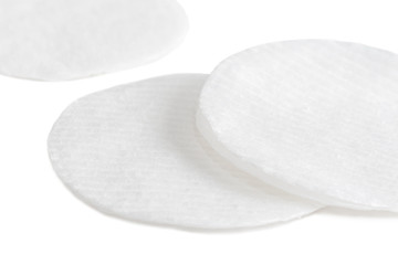 Fototapeta na wymiar Hygienic cotton pads for wiping and facial skin care on a white background.
