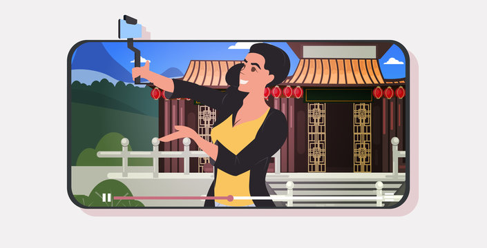 woman traveler using selfie stick photographing chinese pagoda in traditional style live streaming traveling blogging concept smartphone screen mobile app horizontal portrait vector illustration