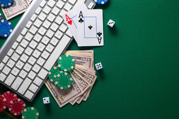 Poker online, casino, online gaming business. Chips, cards money and pc. Background for online