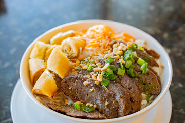 Close up shot of a bowl of pork meat noodle