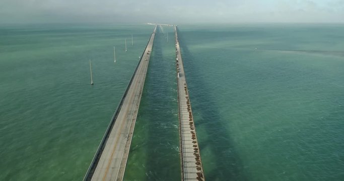 Aerial View of Seven Mile Bridge in The Florida Keys on a Beautiful Day With Beautiful Turquoise Water Tracking Forward Pan Up