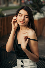 Beautiful model posing for the camera on the street.