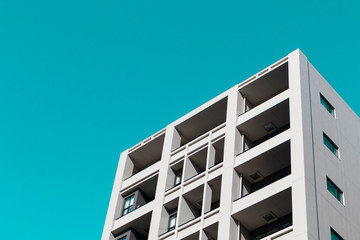 High rise buiding in the city of Tokyo with clear sky in turquoise