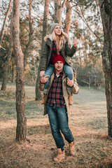 Couple travelers is so fun in the forest. Concept of trekking, adventure and seasonal vacation.