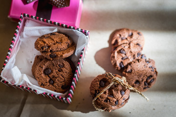 Chocolate cookies and Gift box on wood table
