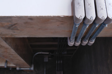 Electrical wiring work in a steel pipe of a house with a loft style decoration design.