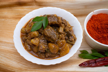 Beef curry, hot and spicy non vegetarian meat dish prepared using Indian spices in Kerala India.