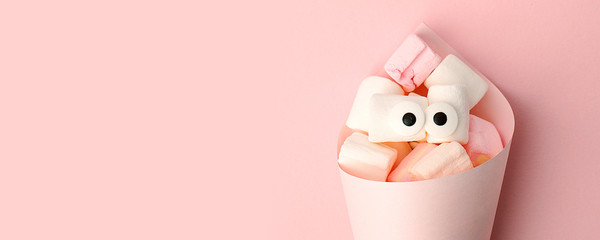 Marshmallows with eyes. Funny kawaii emoji face. Cute cartoon character. Minimal summer flat lay design. Sweet food. Blue background, monochrome concept, banner, copy space