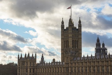 Fototapeta na wymiar The Westminster Abbey with a United Kingdom Flag.