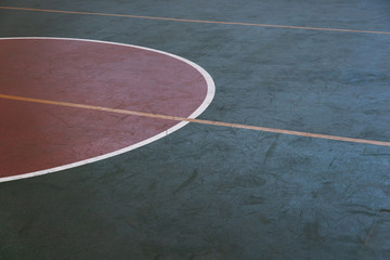 dark green sport gymnasium floor with red circle background