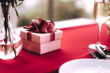 Valentine date dinner table with gift box